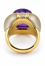 Yellow gold ring with oval amethyst center and small diamond bezel on top