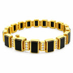 Gold bracelet with alternating black onyx squares and diamond accents in polished frames