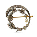 Rose gold floral brooch with diamonds, a pearl drop, and a curved diamond-set frame