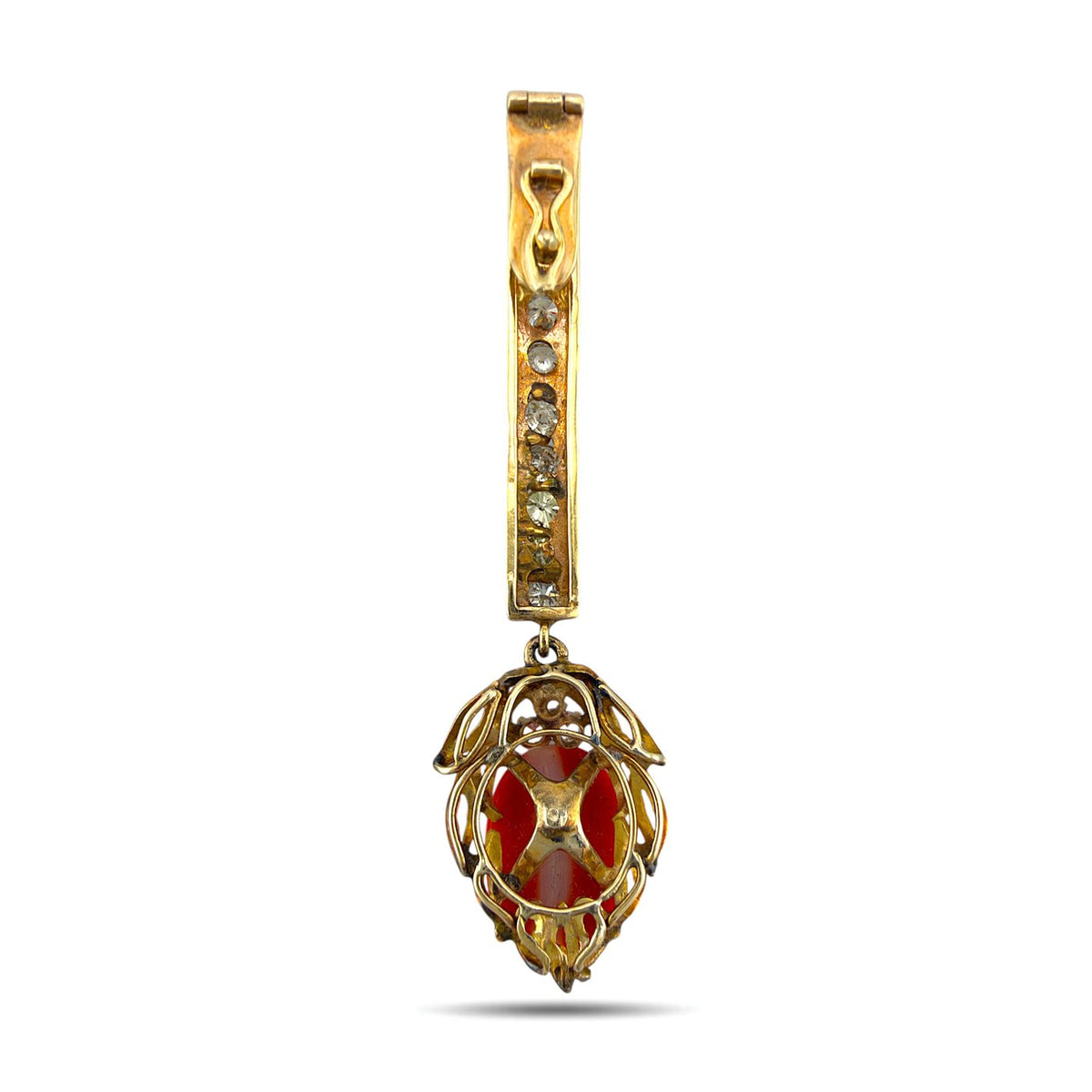 Back of rose gold coral drop pendant with openwork setting and stones along the bar