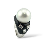 White gold ring with pearl cabochon, black onyx band, emerald-cut diamond accents