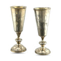 Pair of antique silver goblet cups with engraved floral details and flared bases