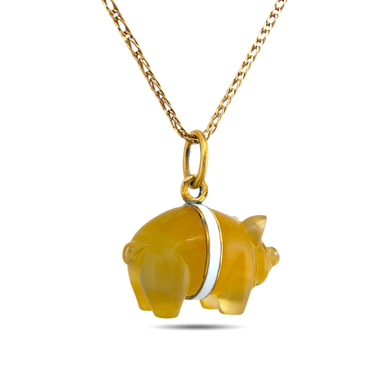 Pig pendant showing its back and white enamel band on a gold-tone chain.