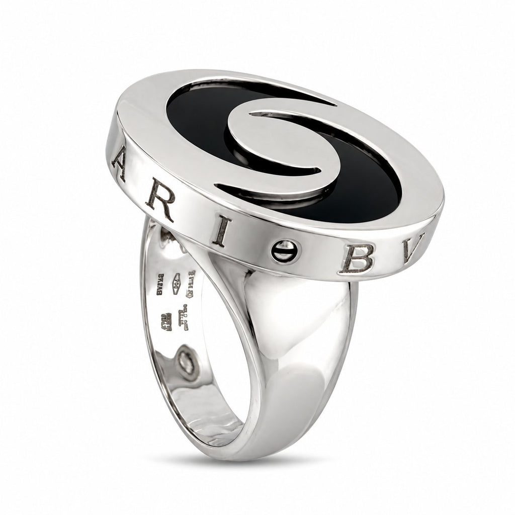 Polished spinning top ring with black yin-yang inset and engraved letters