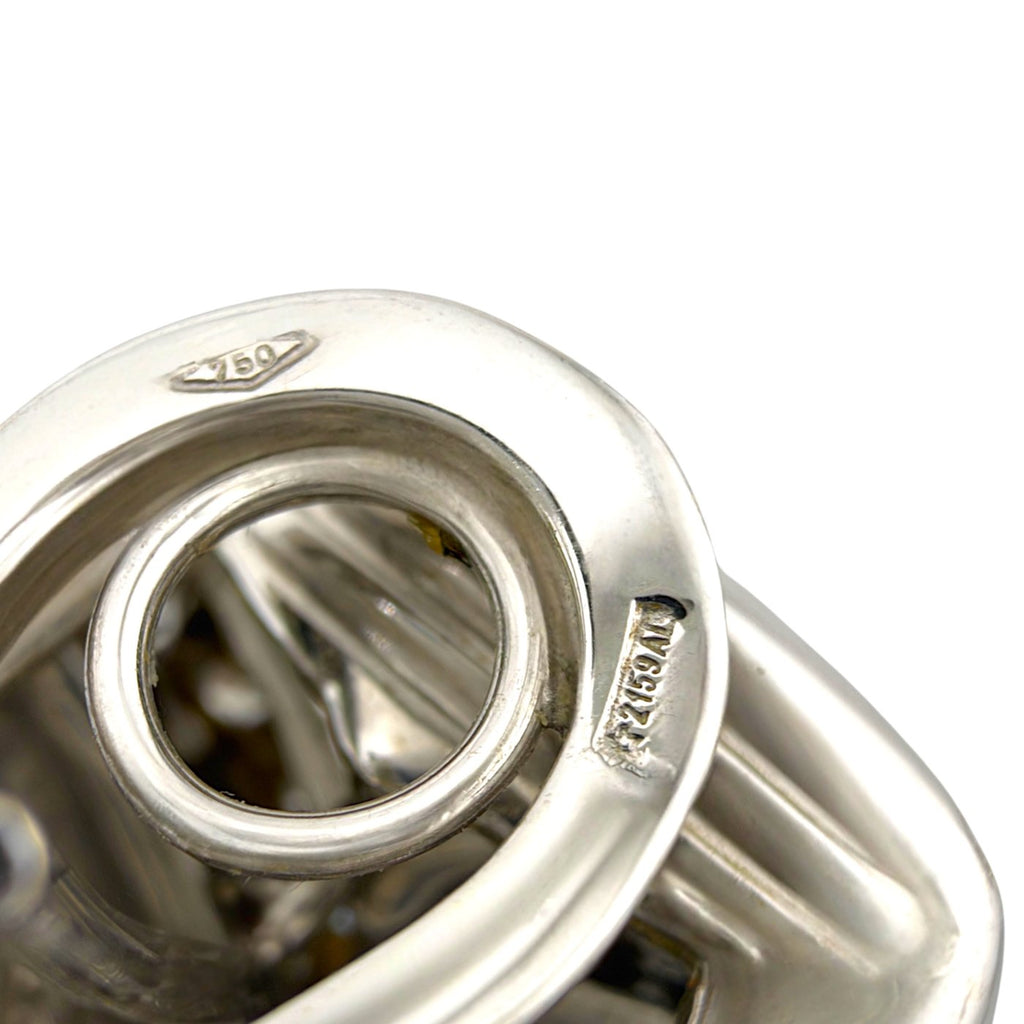 Close-up of the white gold earring back with 750 and maker's hallmarks