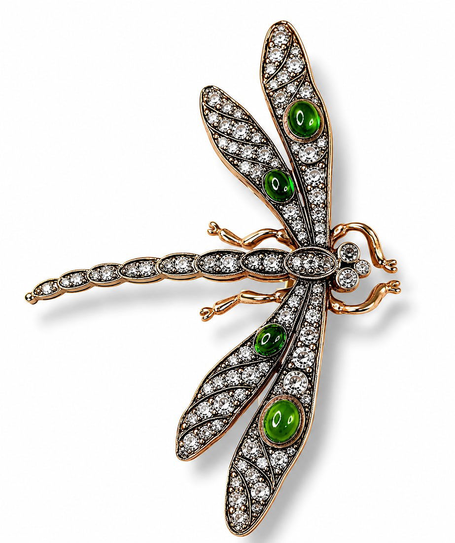 Dragonfly brooch with green oval enamel centers and clear rhinestone wings, gold tone