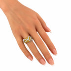 Citrine and diamond white-gold ring on fingers, close-up view