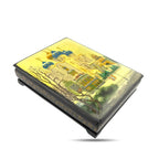 Black lacquer trinket box with church illustration on top, angled side view