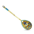 Ornate enamel spoon with blue border and gold scrollwork floral design