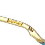 Antique enamel spoon handle with gold inscription detail near the stem