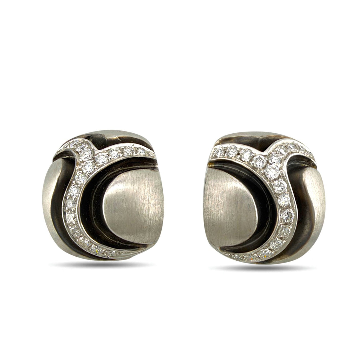 Pair of sculpted diamond earrings shown from a low front angle