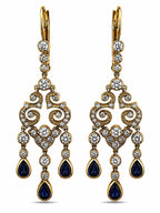 Gold tone chandelier earrings with white diamonds and blue teardrop enamel drops