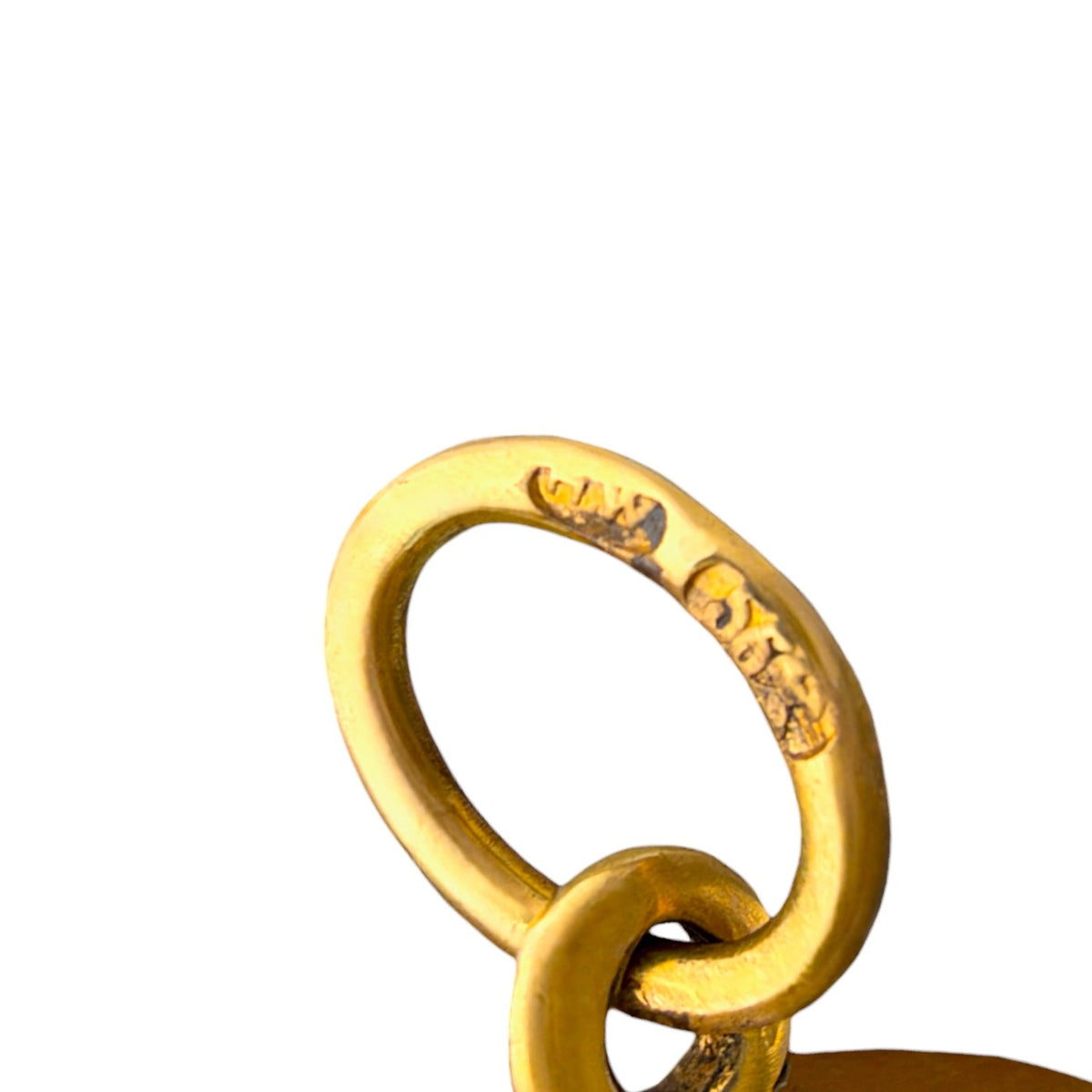 Close-up of the pendant's gold-tone suspension ring with engraved hallmarks.