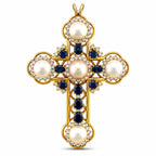 Gold cross pendant with pearl centers, blue sapphires, and diamond halo accents