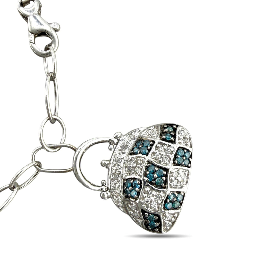 Oval white-gold charm with blue square inlays and sparkling pave border