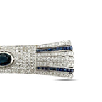 Diamond bar brooch close-up: blue sapphire stripe panel with partial oval blue center stone