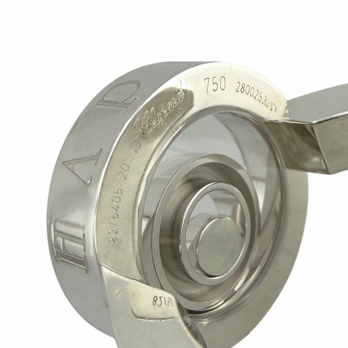 White gold ring interior view with hallmark stamps and circular setting details