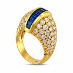 18K yellow gold sapphire and diamond ring with blue baguette center and pavé diamonds