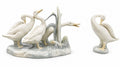 LLADRO glazed porcelain goose figurines: two standing geese with molded base.