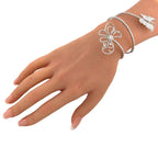 Diamond flower and butterfly bracelet wrapping around the wrist