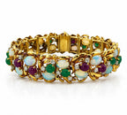 18K yellow gold tennis bracelet with opal, green and purple gemstones and diamond accents