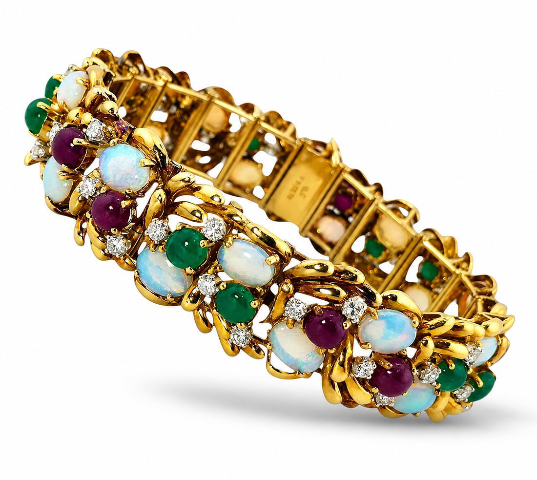 Yellow gold link bracelet with opal drops, green and purple gems, and diamond detail