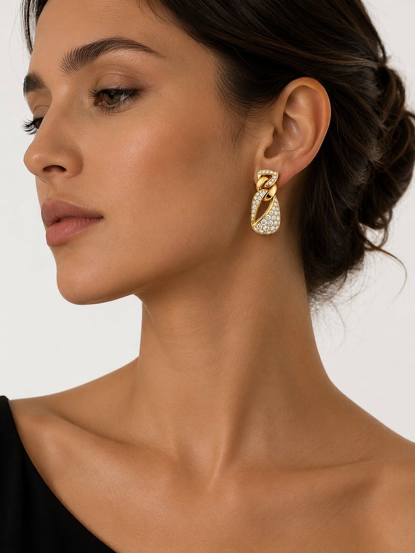 Yellow gold diamond earrings with pave teardrop detail, side view on ear