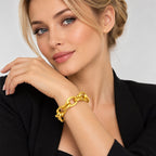 18K yellow gold textured oval link bracelet on wrist, interlocking oval links
