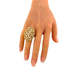 18K yellow gold diamond statement ring on a hand