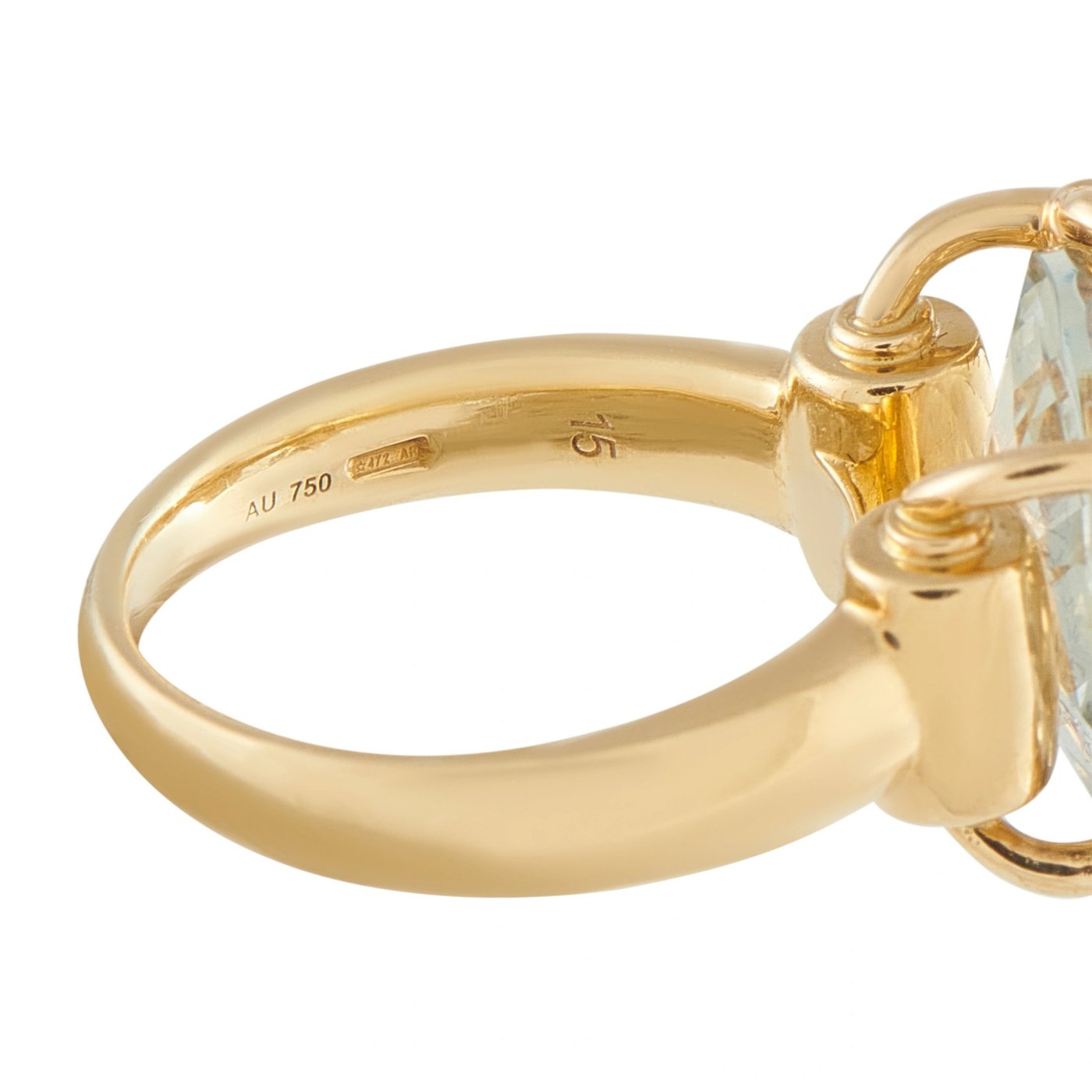 Yellow gold band close-up with AU 750 hallmark and horsebit-style setting