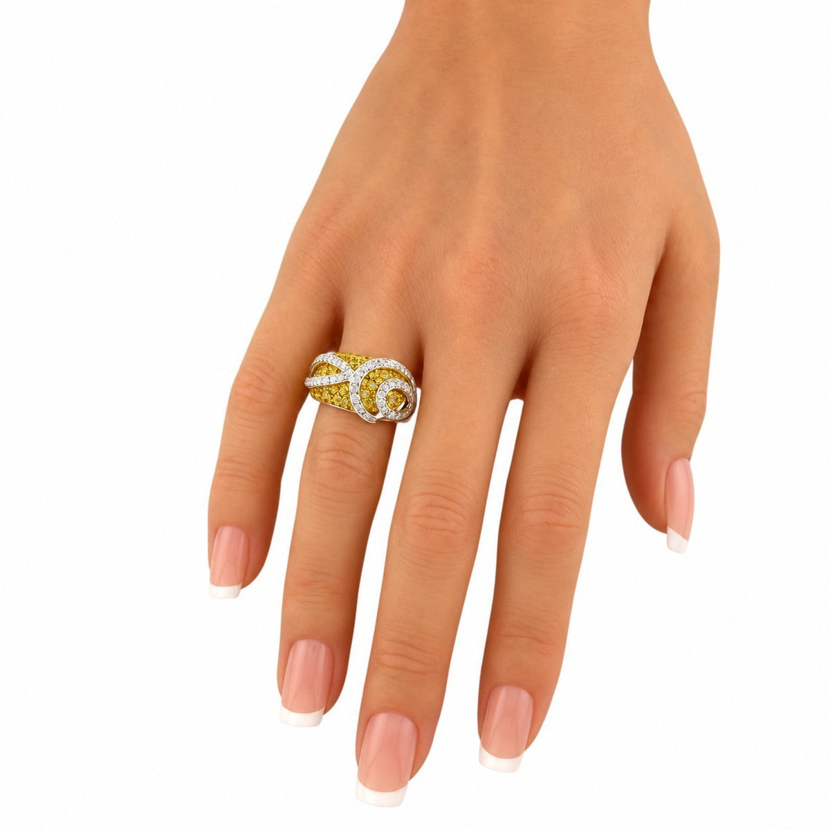 White-gold citrine and diamond swirl ring on hand, nail-polished fingers