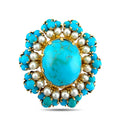 Gold pendant brooch with oval turquoise cabochon, blue stones, and white pearls