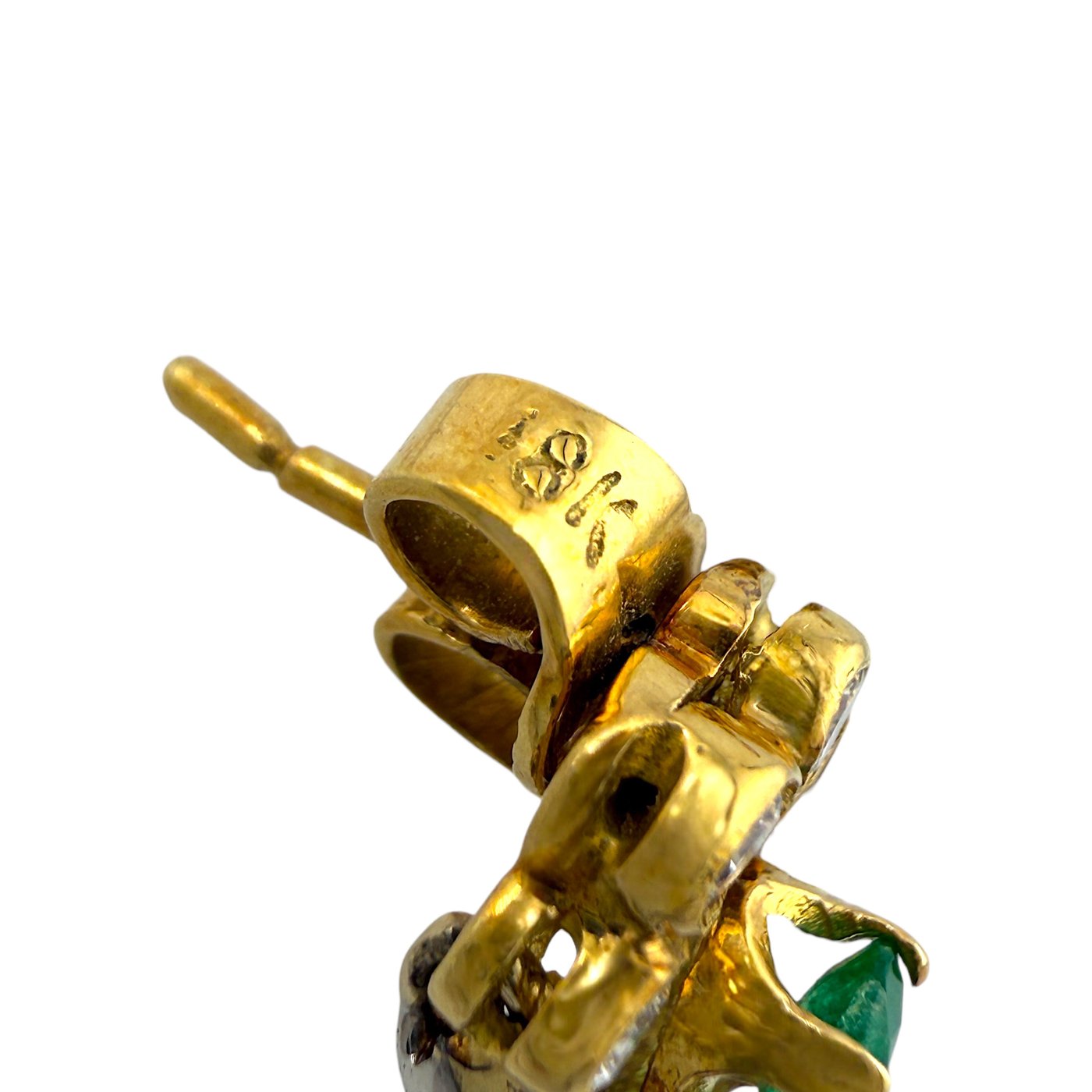 Gold bracelet clasp and hinge with small emerald detail near the closure