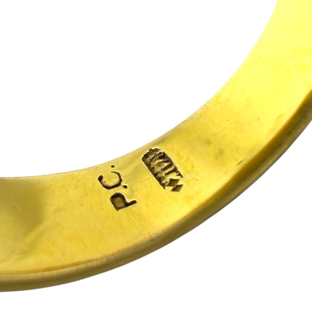 Gold ring band close-up with stamped 14K marking