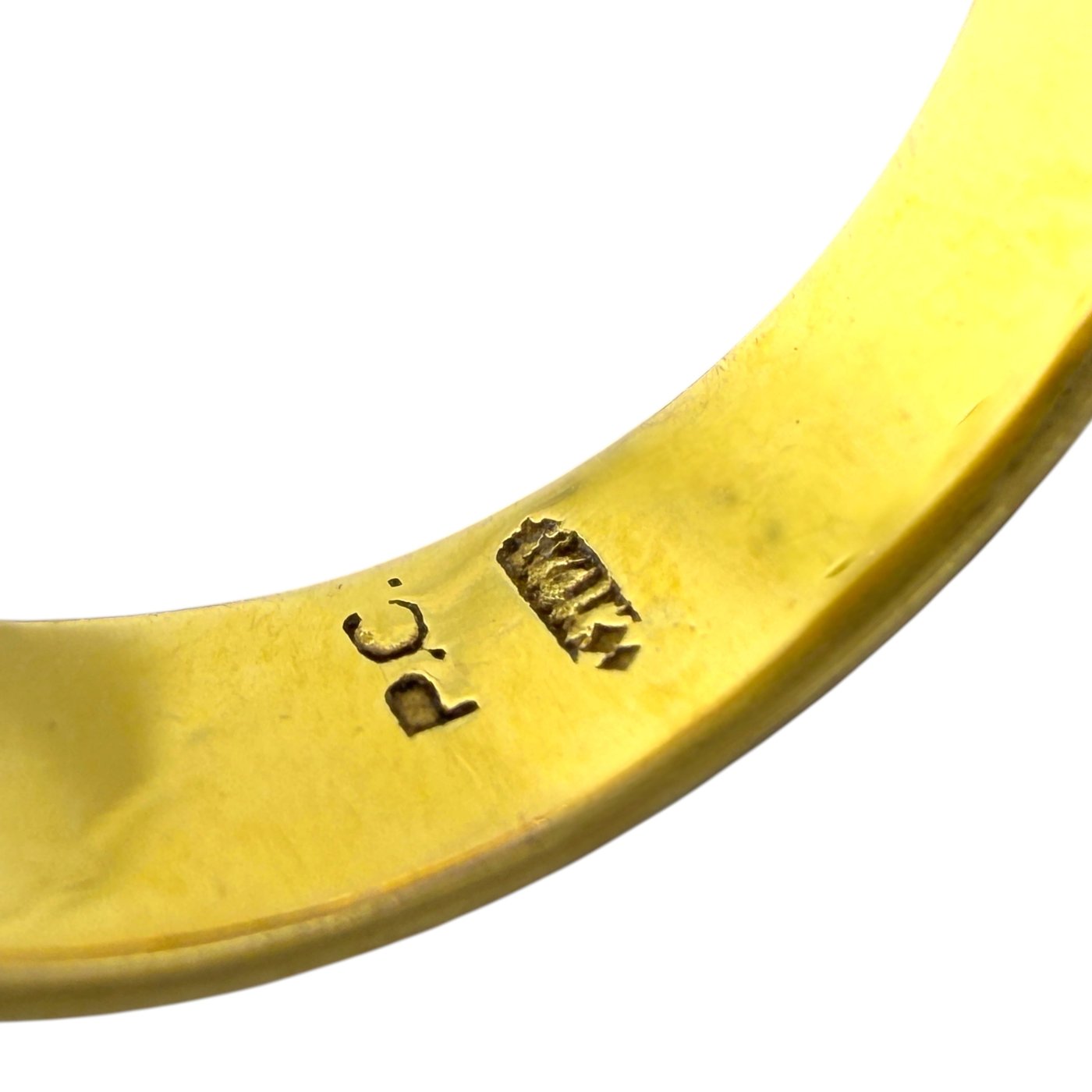 Gold ring band close-up with stamped 14K marking