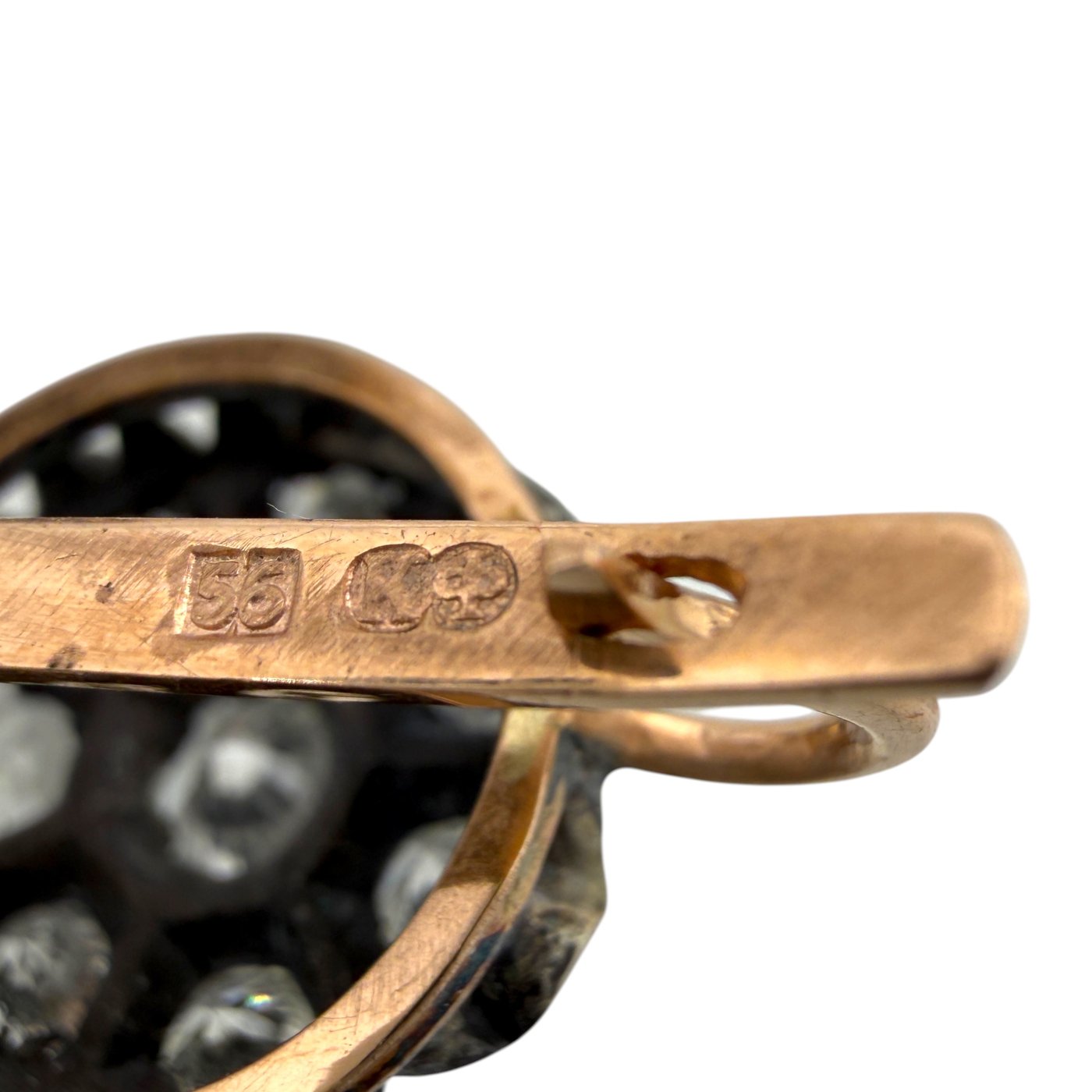 Rose gold earring back with stamped hallmark and black diamond bezel