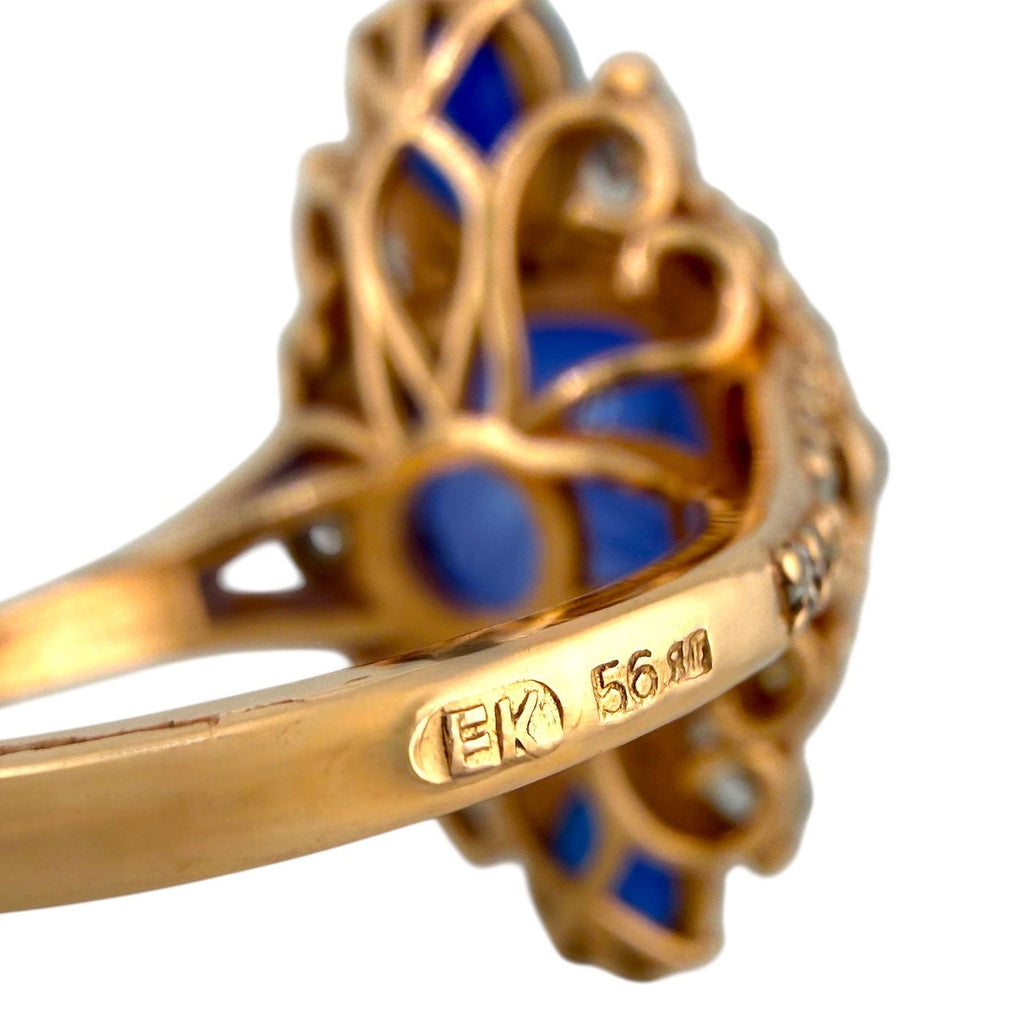 Rose-gold ring band close-up with hallmark engraving and number 56