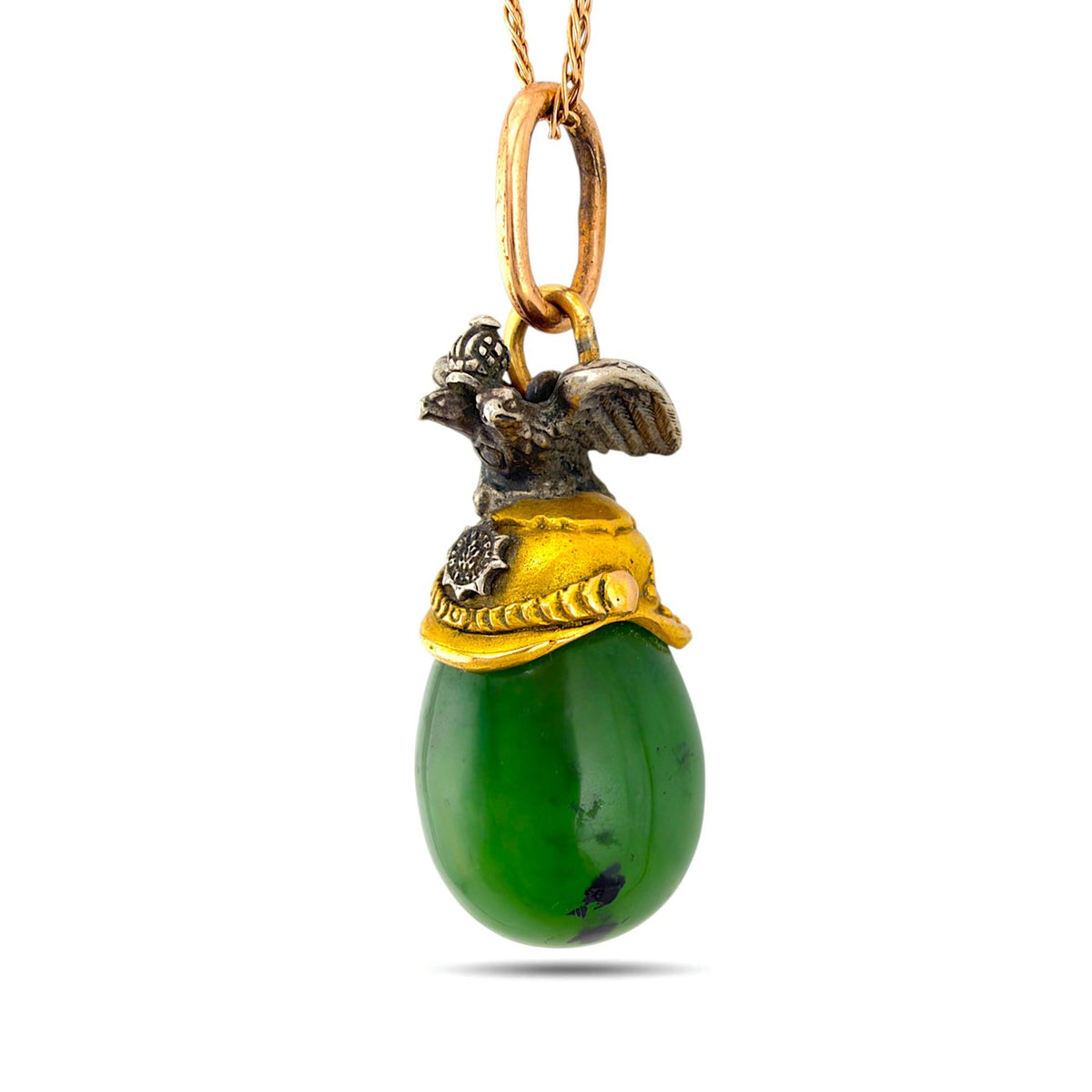 Reverse angle of green nephrite egg pendant with ornate gold cap and eagle finial
