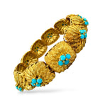 18K yellow gold turquoise bead bracelet, angled view of textured links with turquoise flowers