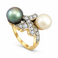 Gold ring with iridescent green pearl, white pearl, and diamond accents