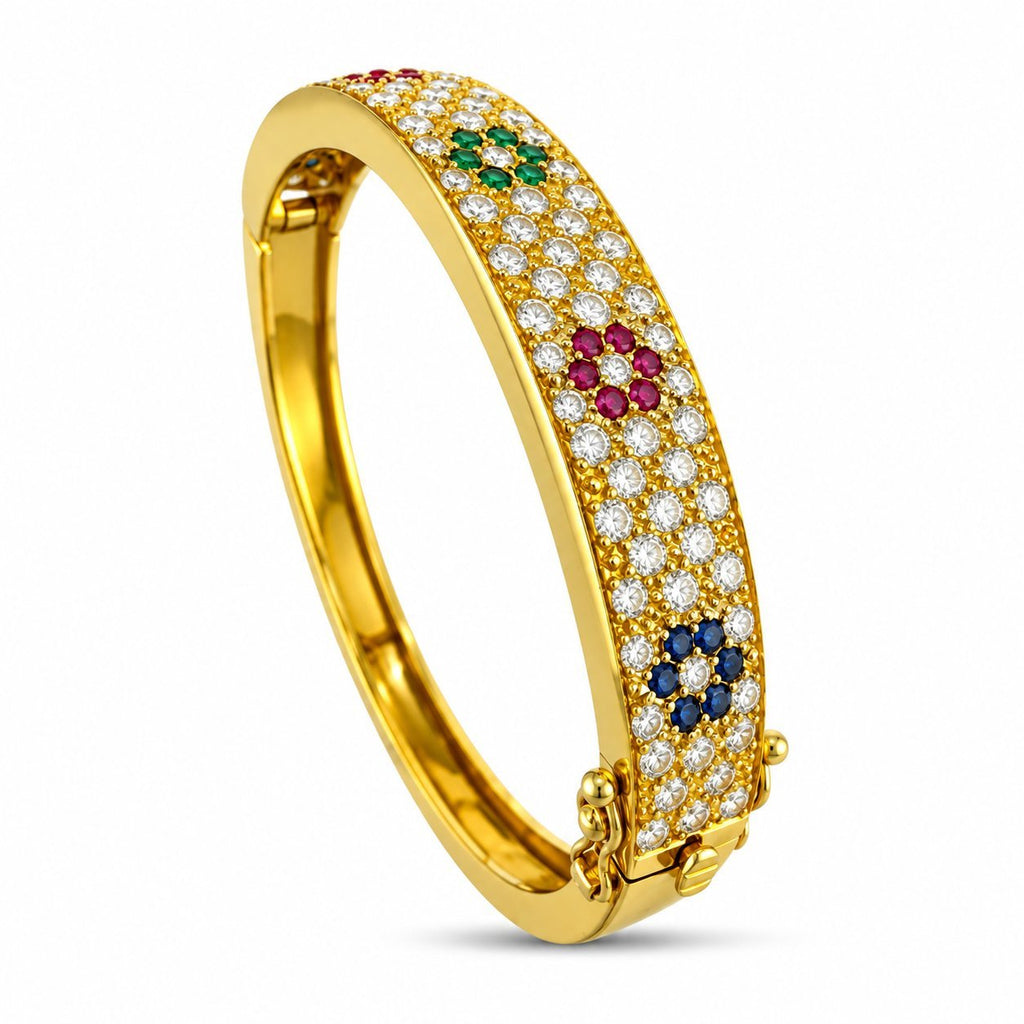 Yellow gold hinged cuff bracelet with diamond pave, green and pink stones, and blue accents