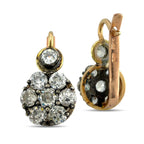 Rose gold diamond cluster earrings with round stones, showing the back and hinge.
