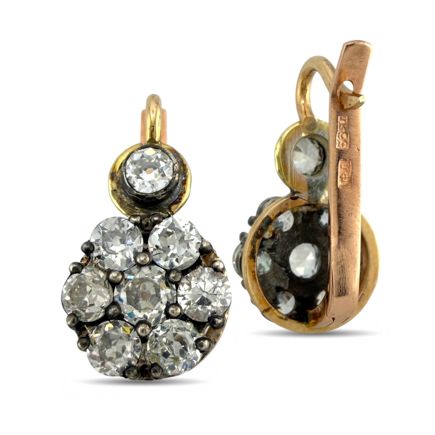Rose gold diamond cluster earrings with round stones, showing the back and hinge.