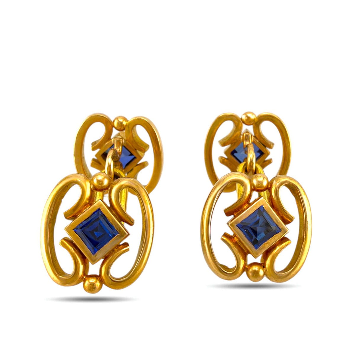Faberge cufflinks in yellow gold with blue sapphire centers
