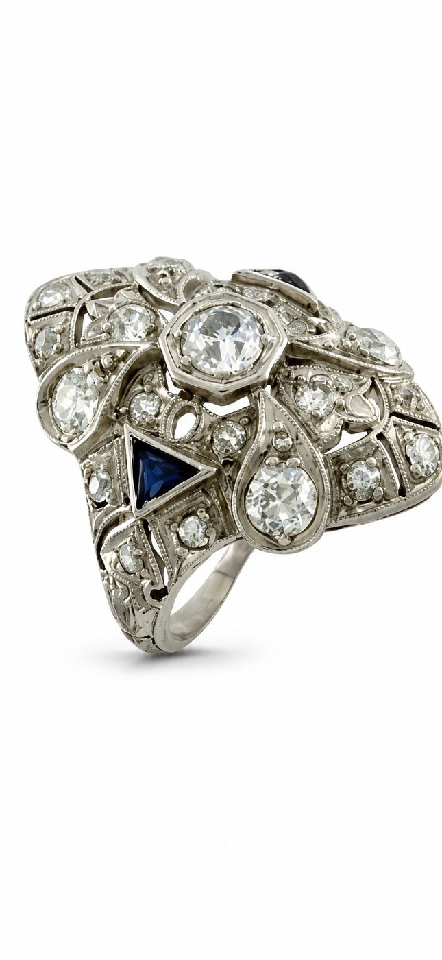 Art Deco diamond ring with blue triangular sapphire accent and round stones, platinum-tone