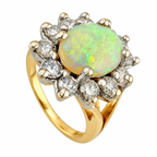 14K yellow gold ring with oval opal center and diamond halo, prong-set.