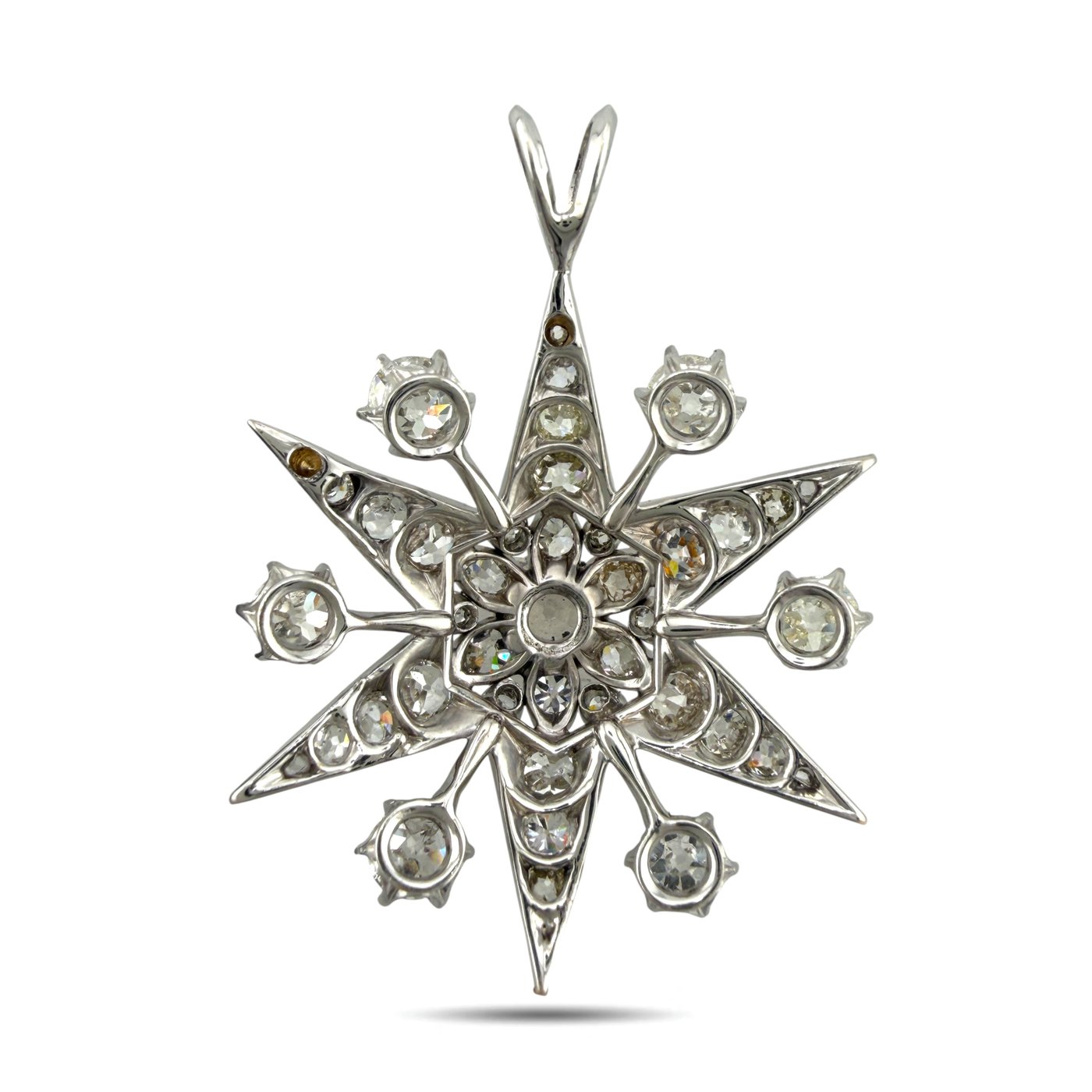 Back view of star diamond pendant in 18K white gold with prong-set stones