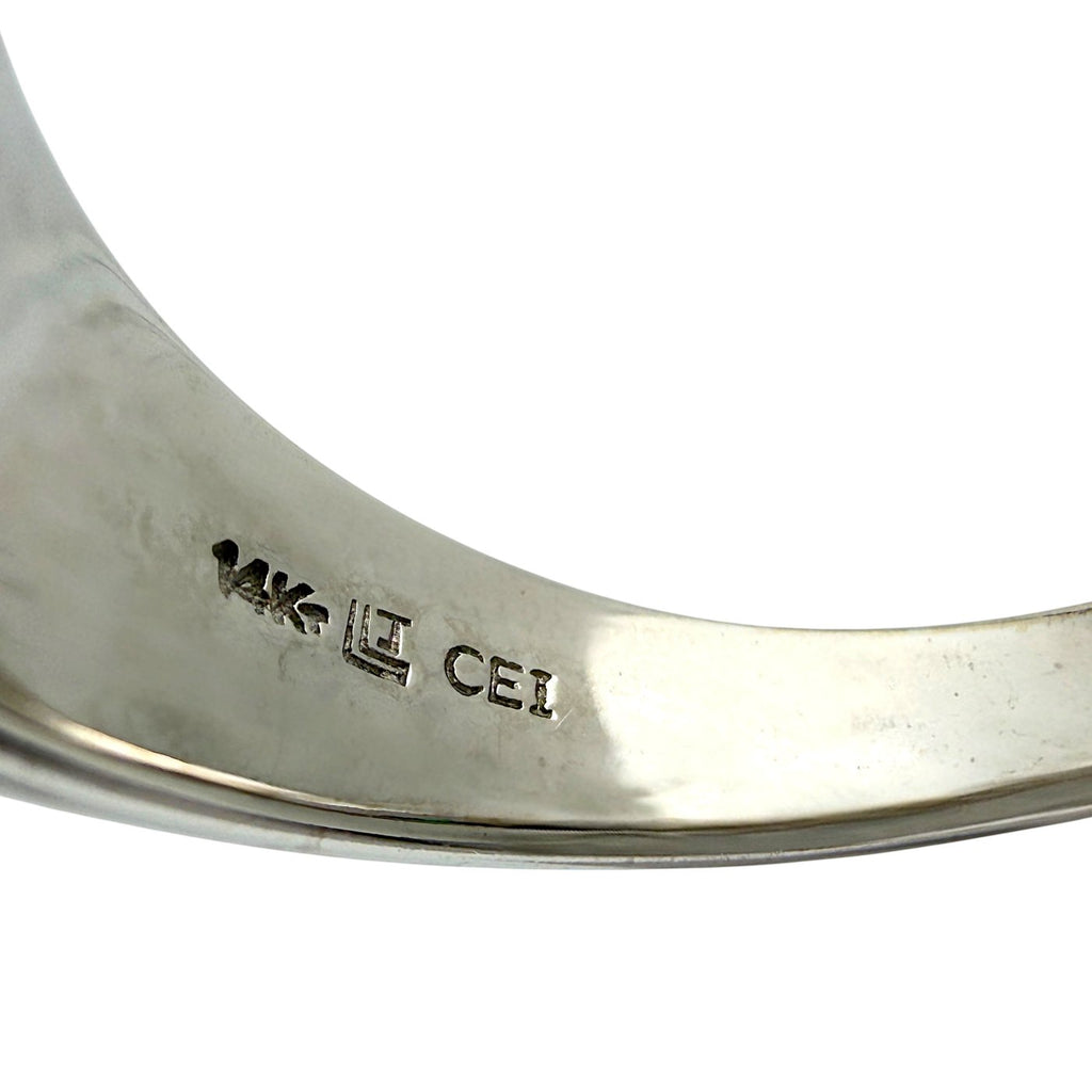 Inside band of white gold ring with stamped metal hallmark engraving