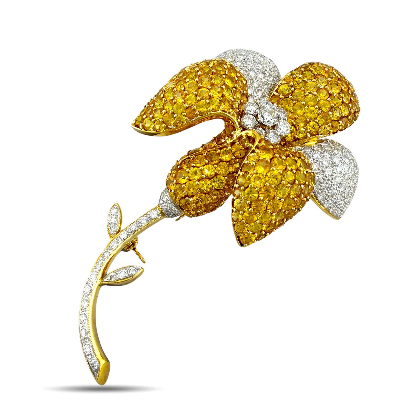 Flower brooch detail with yellow citrine petals, central diamond cluster, and leaf accents