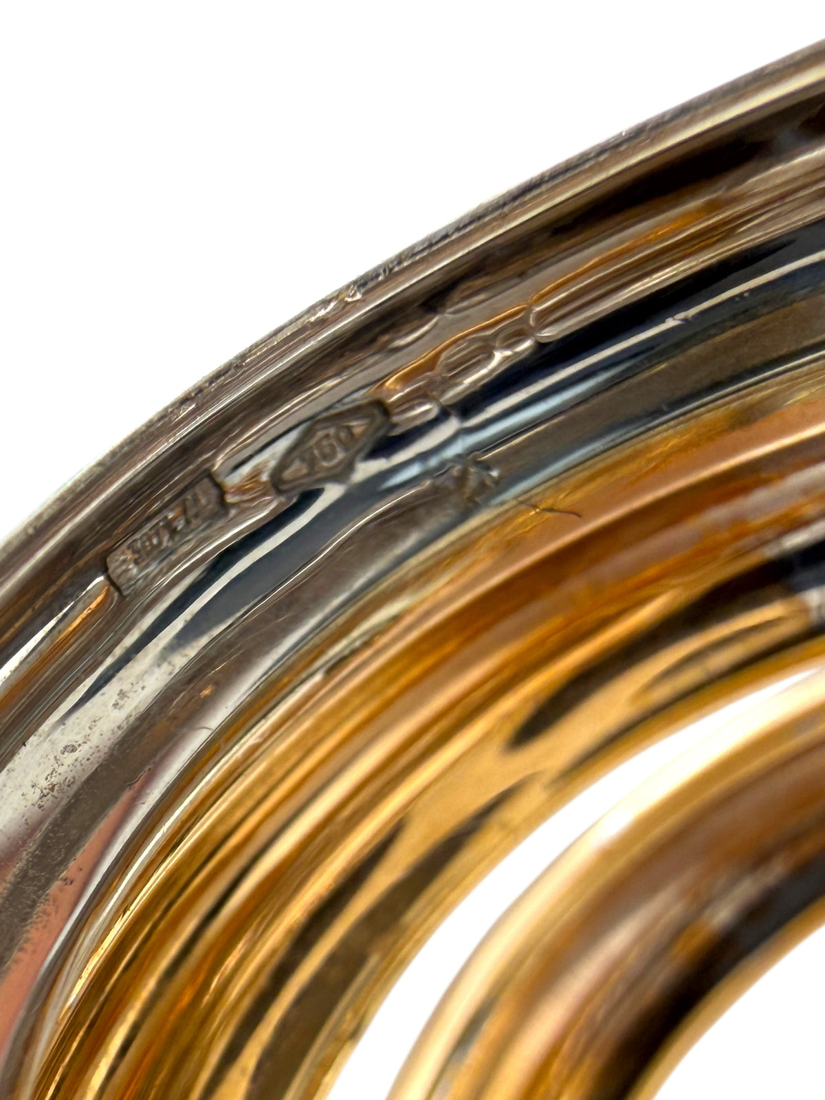 Two-tone gold and white gold ring with diamond accents, side close-up